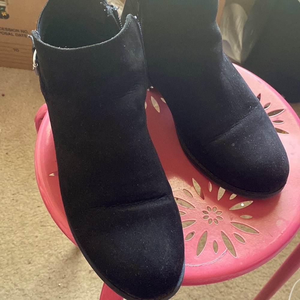 Faux suede ankle boots with a silver buckle on the side. Zipper on side